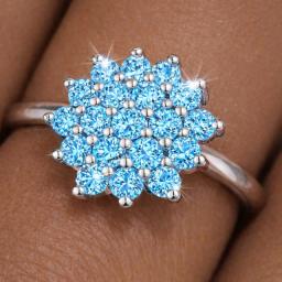 cluster moissanite ring on models finger sea blue