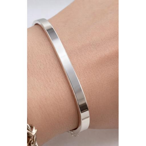 Sterling silver square bangle on wrist with full UK assay hallmarking