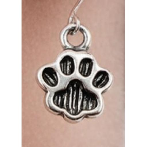 Paw print earrings in ear